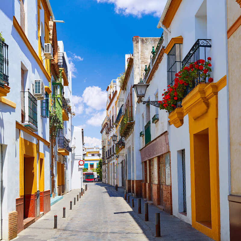 Traditional White Houses Of Triana, A Historical Neighborhood In Seville, Andalusia, Spain