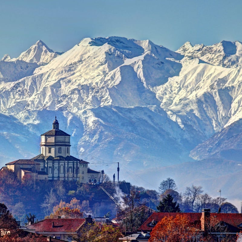 church of Monte Cappuccini in Turin, Piedmont, Italy, surrounded by snowy Alps mountains