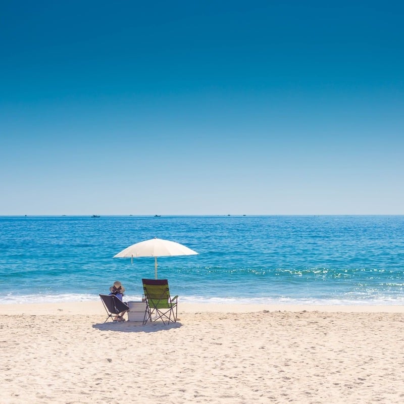 A Golden Sand Beach Where A Beachgoer Is Relaxing In Busan, A Coastal City In South Korea, East Asia