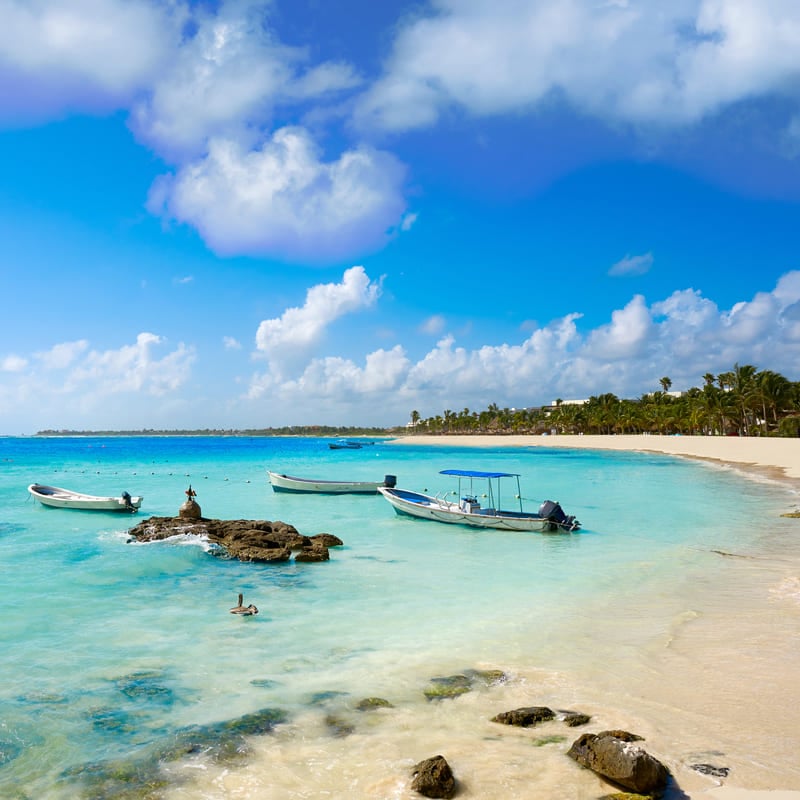 Fishing Boats Docked By A Sandy Beach In Akumal, On The Mayan Riviera, Caribberan Sea, Mexico