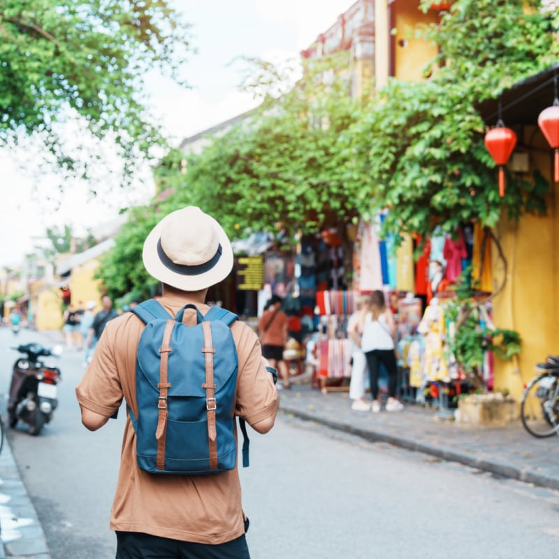 Backpacker Walking Through Hoi An, Vietnam, Southeast Asia