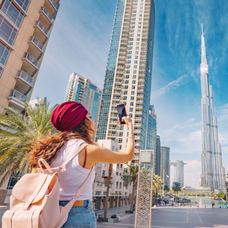 woman taking a picture in downtown Dubai