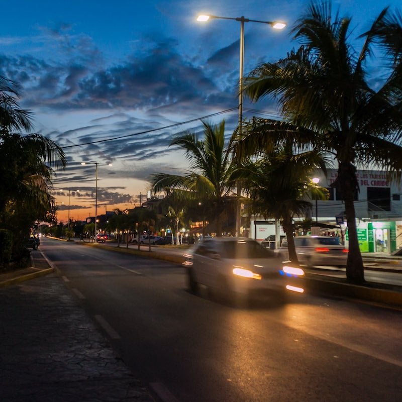 Night view of a main road in Tulum, Mexico.