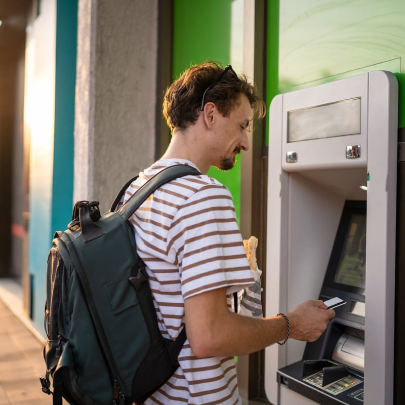 Traveler using ATM