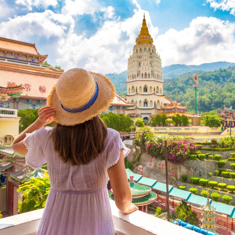 Woman traveler at Kek Lok Si Temple in Georgetown, Penang island, Malaysia