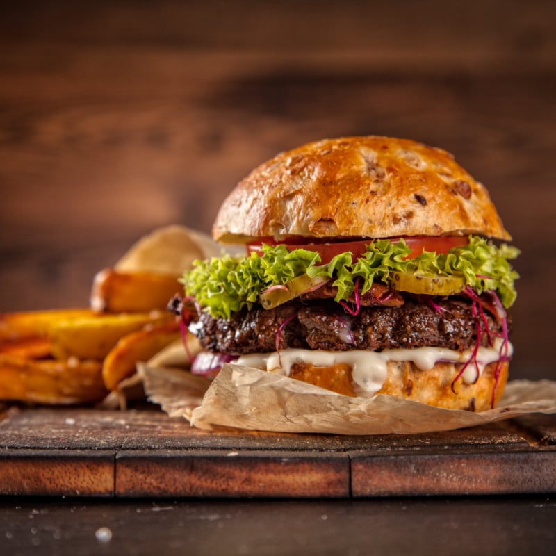 delicious hamburger with cheese and fries