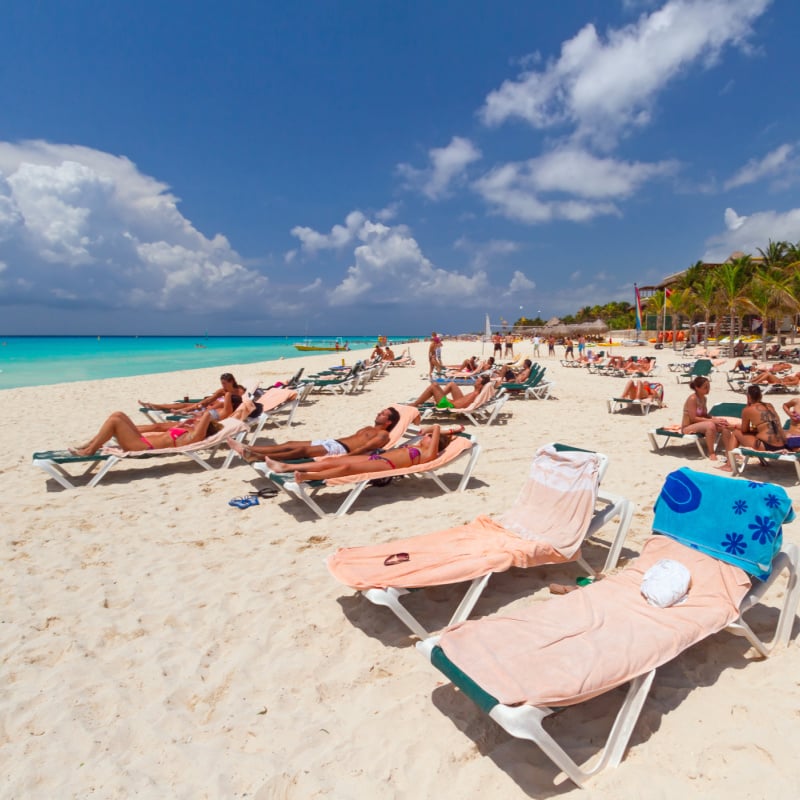 people on a beach in Playa Del Carmen