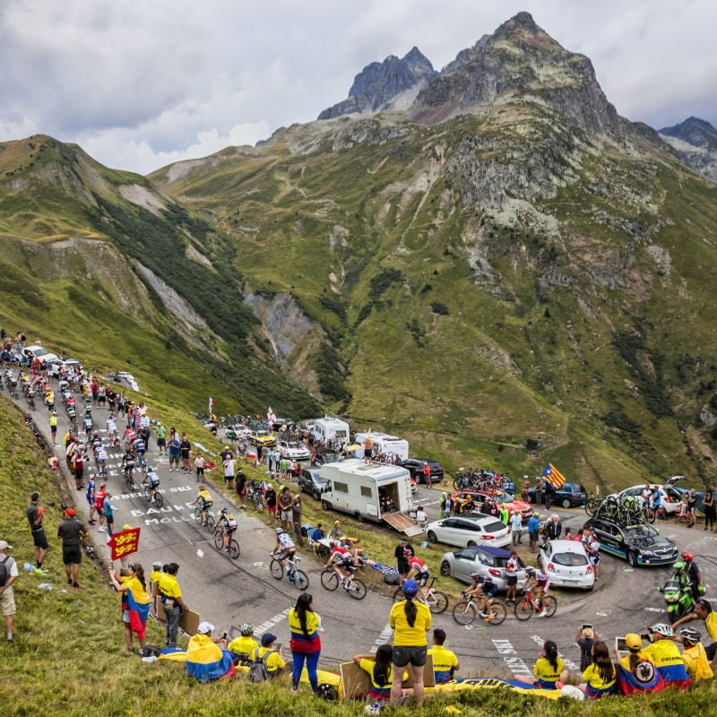 tour de france cycling race passes a hairpin bend at col du glandon