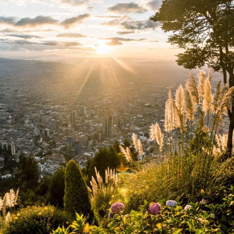 view of bogota city skyline from monserrat in colombia at sunset