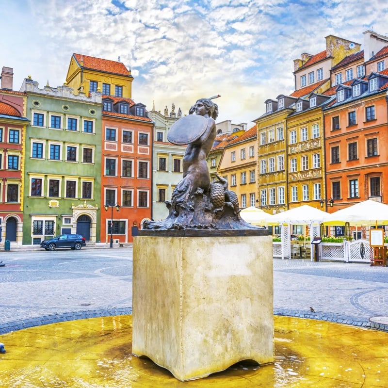 Fountain Mermaid and colorful houses on Old Town Market square in Warsaw, capital of Poland