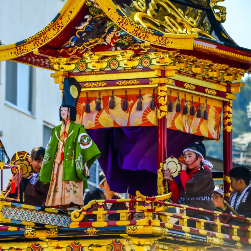 Karakuri-doll-on-ornate-float-at-Takayama-Festival-in-Japan