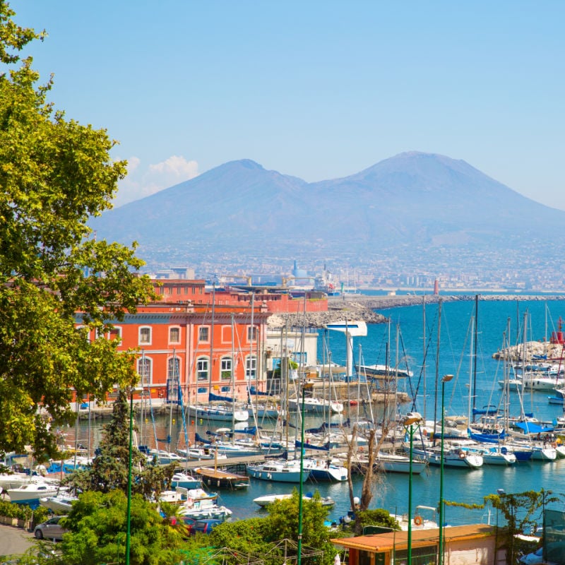 boats and mt vesusis in naples italy