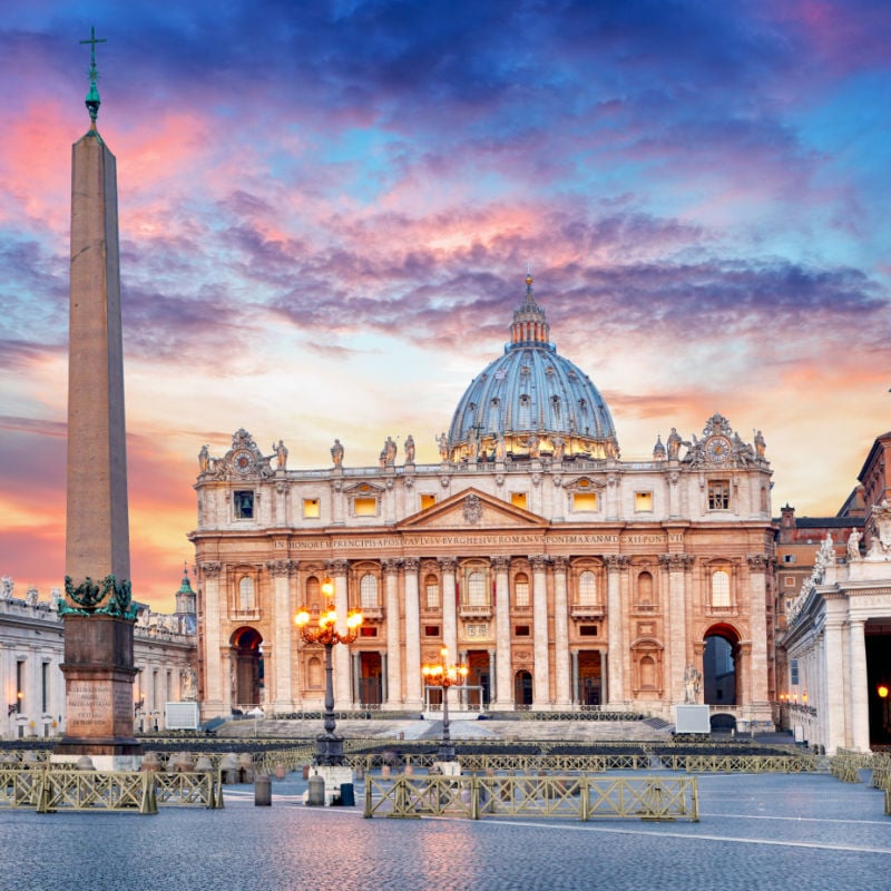 st peters basilica in vatican city with pink and purple sky above