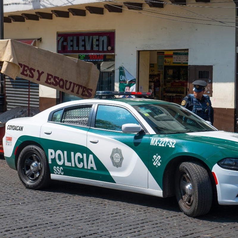 A Police Officer and a Police Car in Mexico City