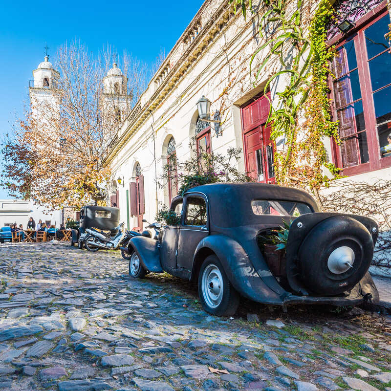 Car parked in a cobblestone street in Colonia Del Sacramento, Colonia Department, Uruguay, South America