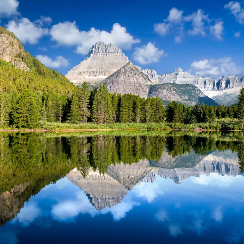 Peaceful calm reflections on Lake Josephine in Glacier National Park