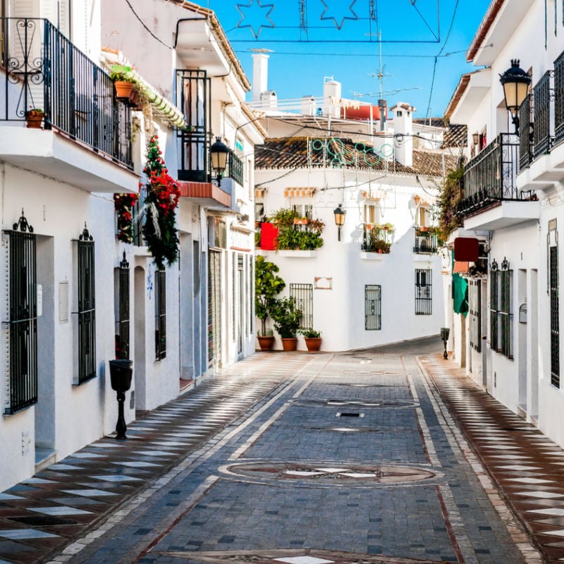 Row of historic white buildings in Benalmadena