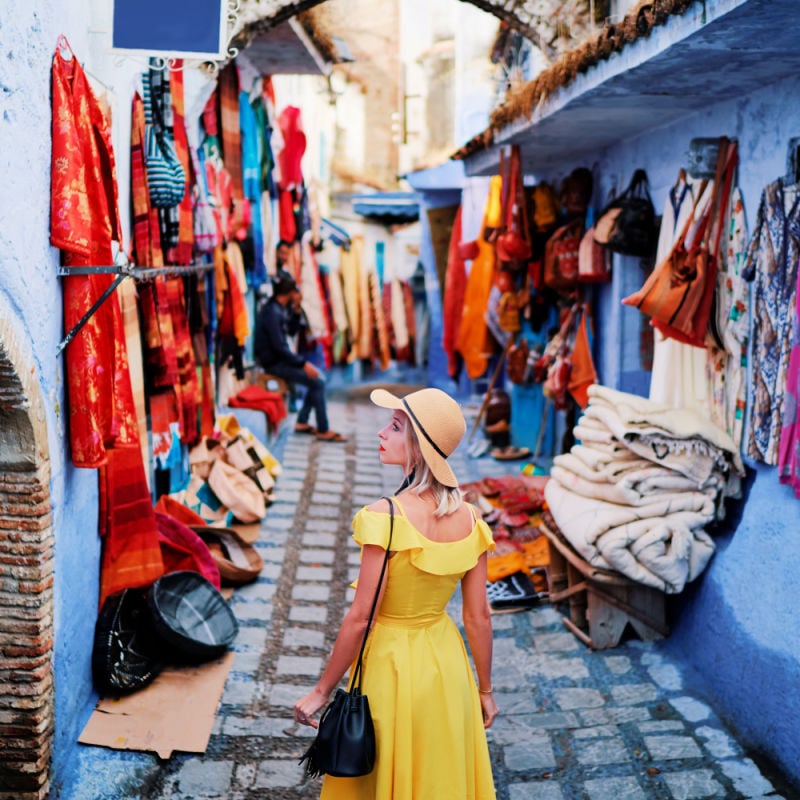 Woman walking through streets in Morocco