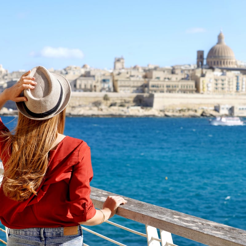 woman overlooking valletta, malta