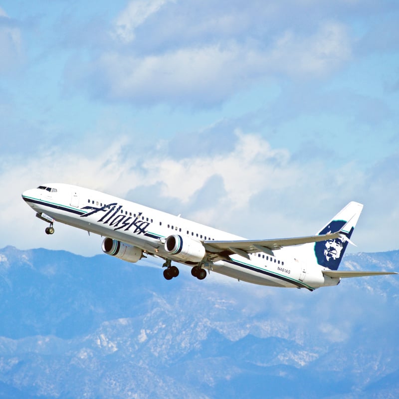 Alaska air plane flying near mountains