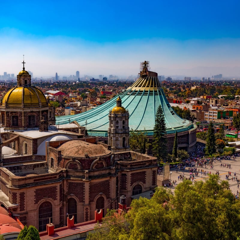 Basilica of Our Lady of Guadalupe. The old and the new basilica, cityscape of Mexico City