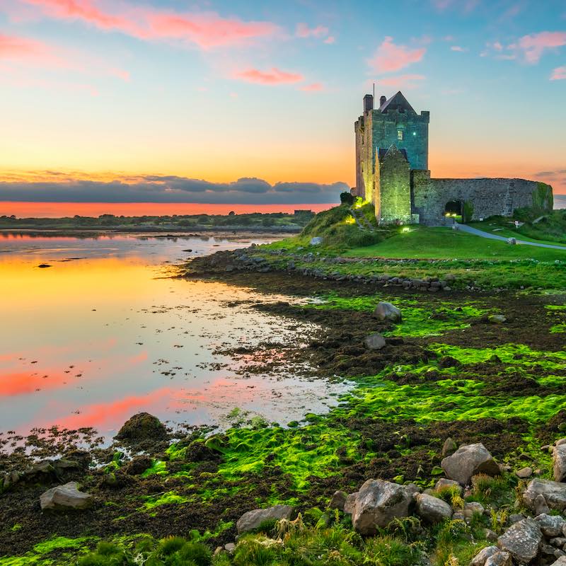 Dunguaire Castle on shores of Galway Bay Ireland by sunset