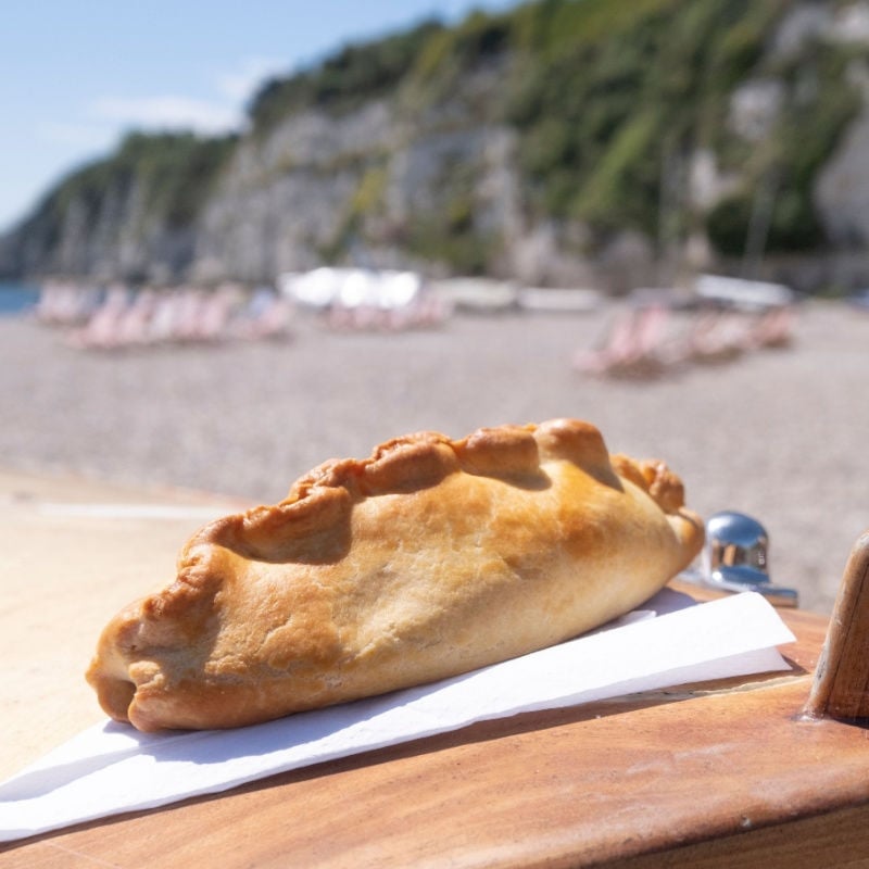 A Cornish pasty on the beach in Cornwall