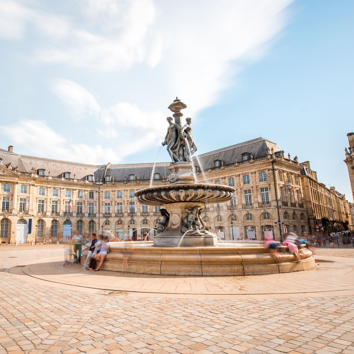 Fountain In A Central Square Flanked By Haussmann Buildings In Bordeaux, France, Southern Europe