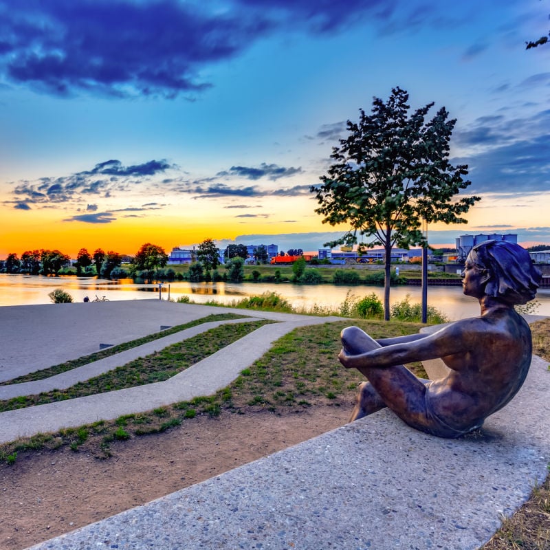 Statue of a young woman along Bamberg canals