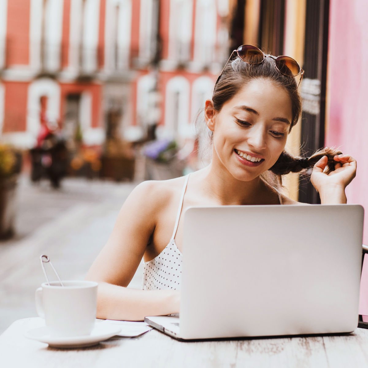 Female digital nomad working in cafe in Mexican city