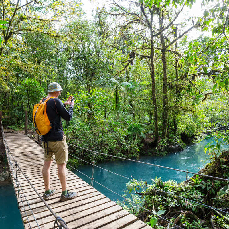 Male Backpacker Exploring The Jungle In Costa Rica, Central America