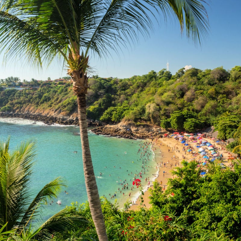 Puerto Escondido, Oaxaca, Mexico, South America[Playa Carrizalillo, crowdwed natural beach, tourist destination