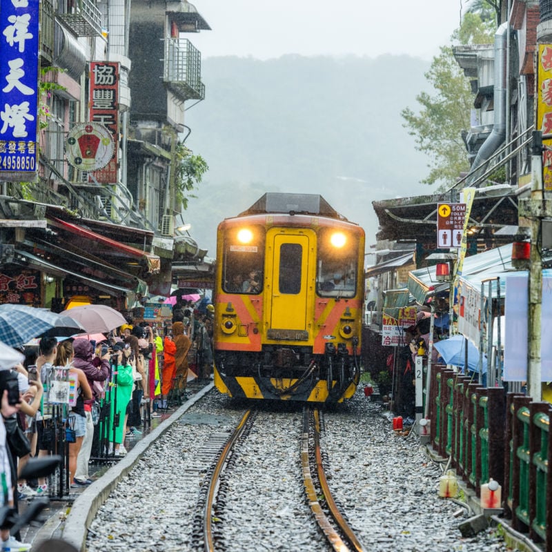 Train passing crowd in Taipei