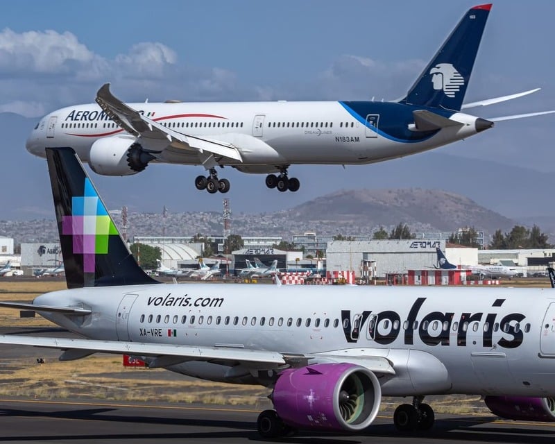 Volaris Aircraft Preparing To Take Off With Aeromexico Aircraft Taking Off In The Background At Mexico International Airport, Mexico City, Mexico