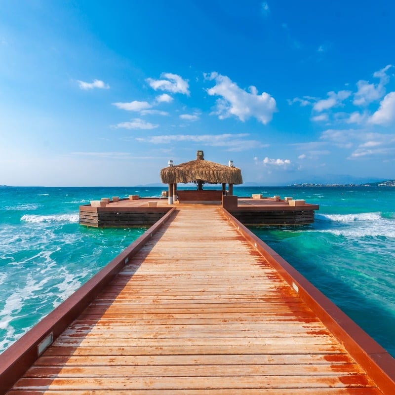 Wooden Pier In Beach Near Izmir, Aegean Coast Of Turkiye, Western Asia, Bounded By The Mediterranean Sea