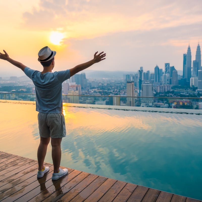 Solo Traveler Admiring A View Of Kuala Lumpur, Malaysia, Southeast Asia