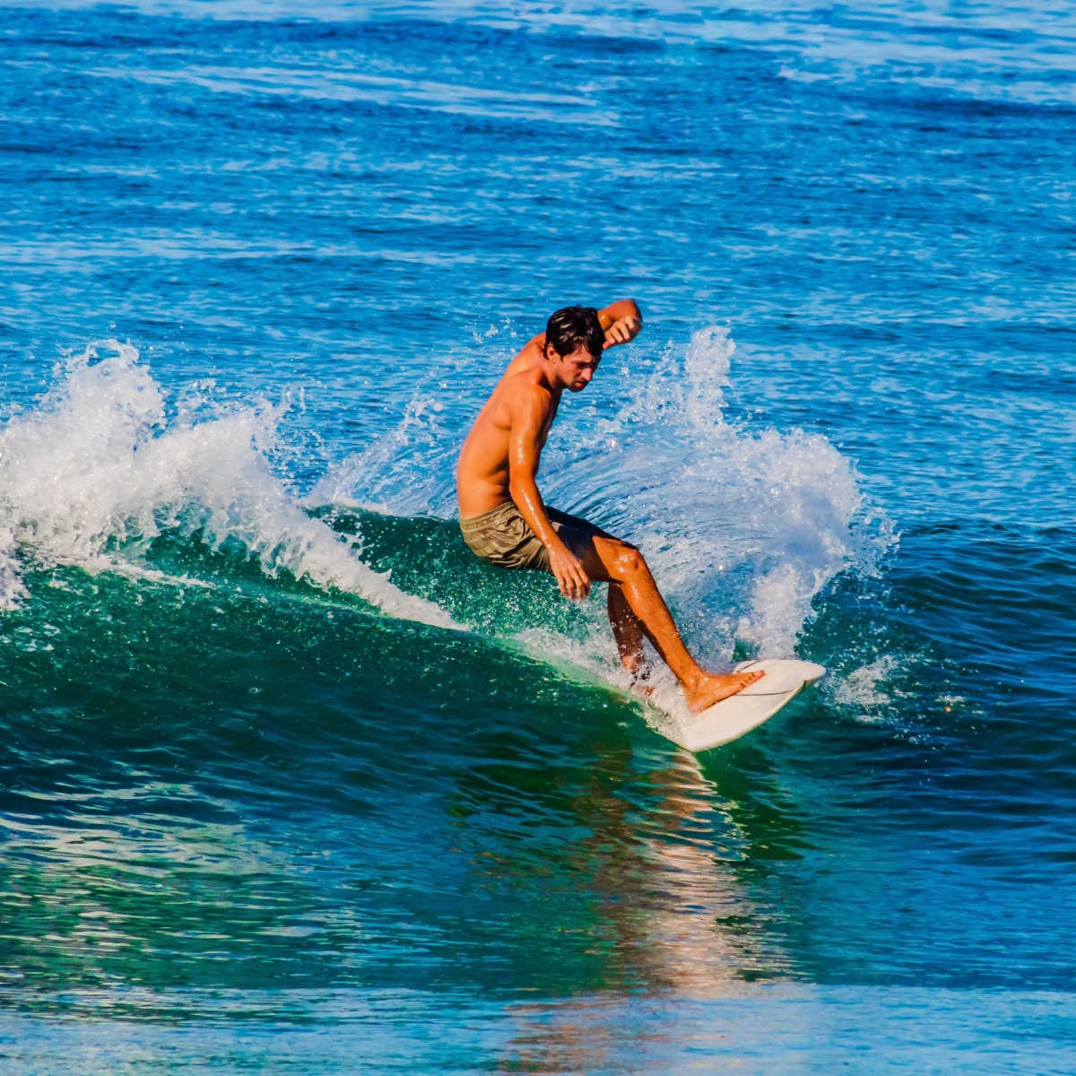 surfer mature man surfing the waves in zicatela puerto escondido oaxaca