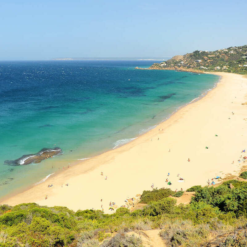 Sandy Beach Lining The Atlantic-Mediterranean Sea In Cadiz, Spain