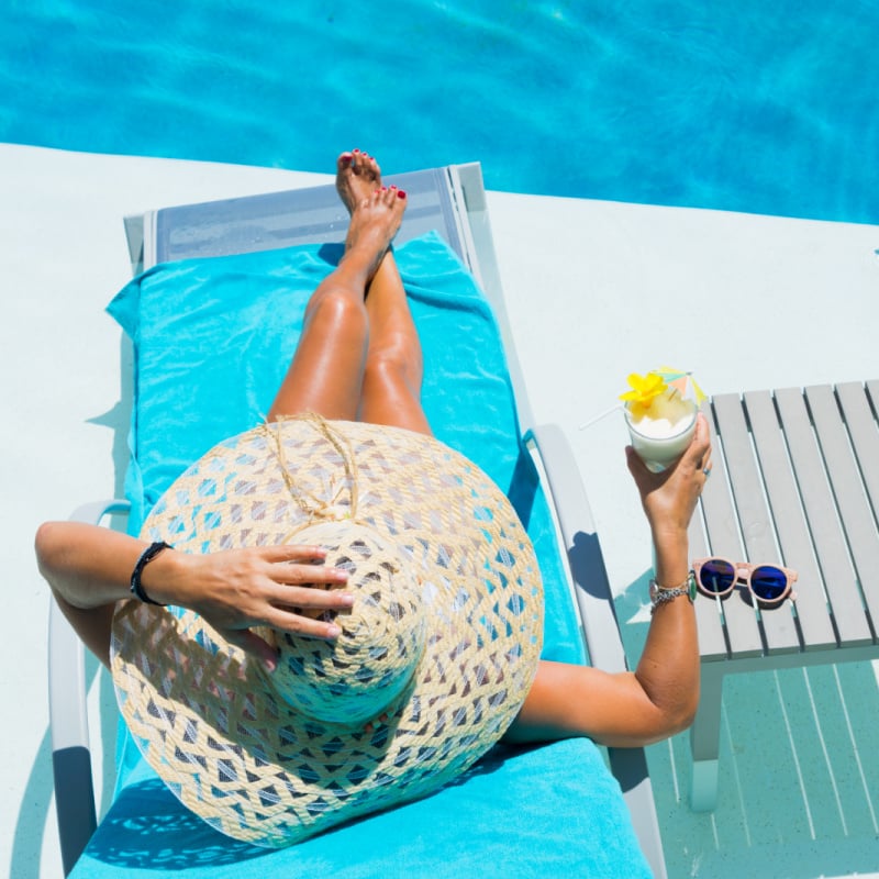 Woman relaxing on a resort pool