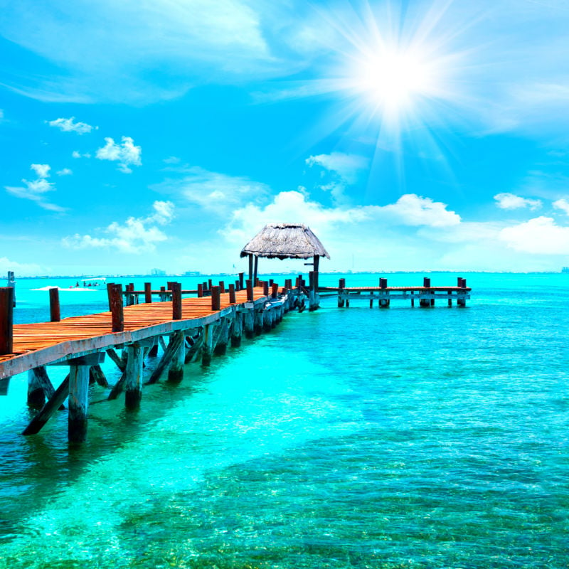 Pier on stunning blue water in Cancun