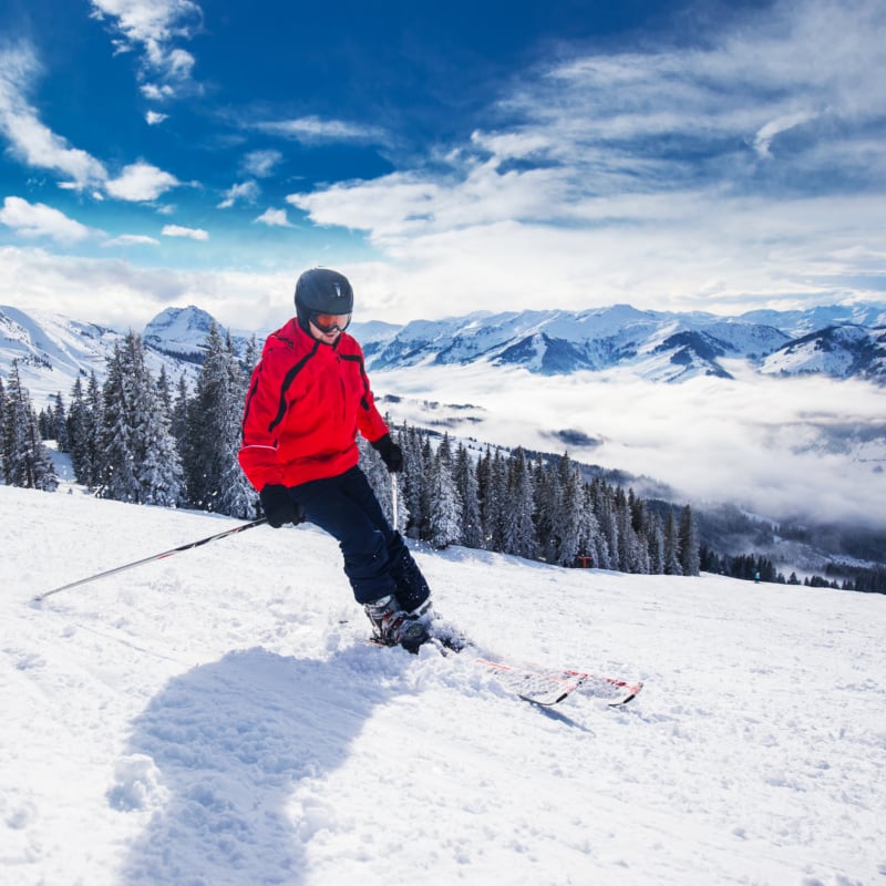 man skiing near kitzbuehel ski resort in austria