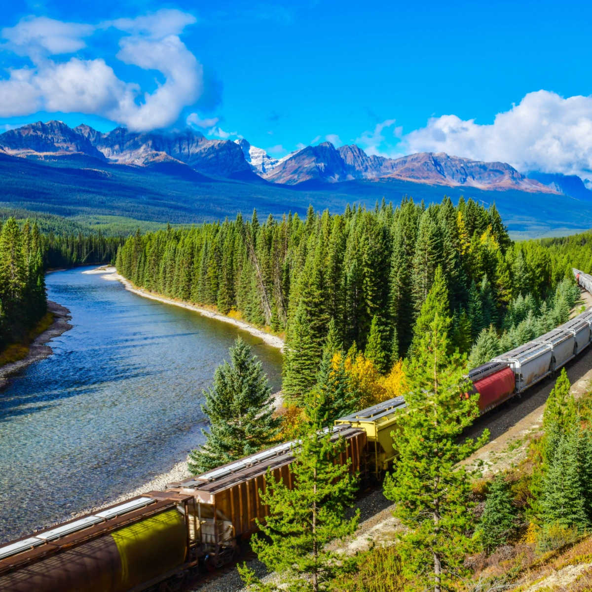 train moving along Bow river in Canadian Rockies ,Banff National Park